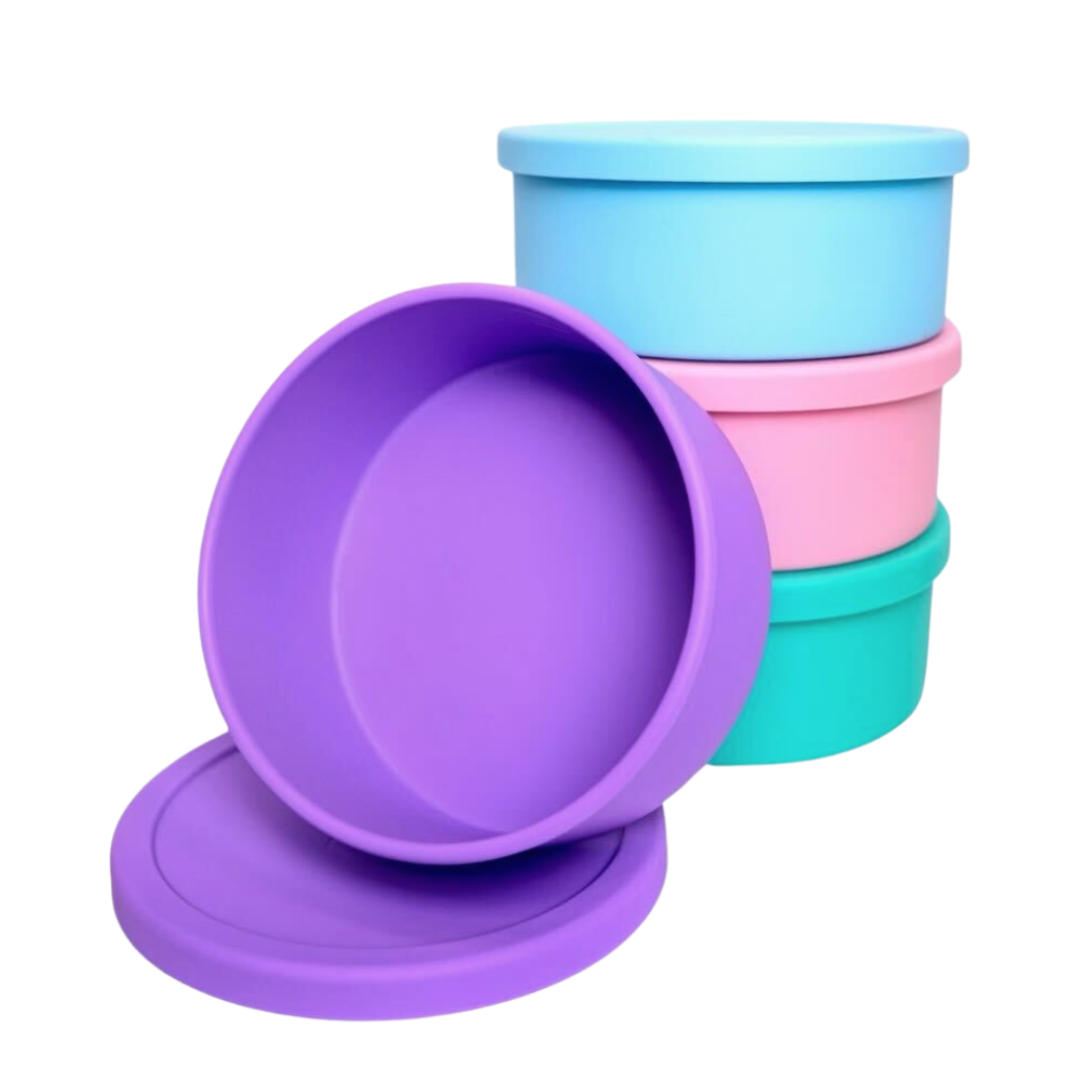 Solid purple, light blue, light pink and sea foam green round silicone bento bowls with Mermaid Straw logo on lid